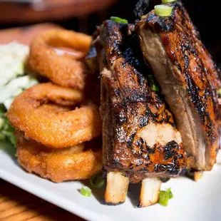 Ribs - St. Louis style served with onion rings and caesar salad