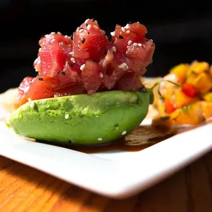 Ahi Avacado - Poke served in Avacado with siracha sauce, papaya salsa and chips