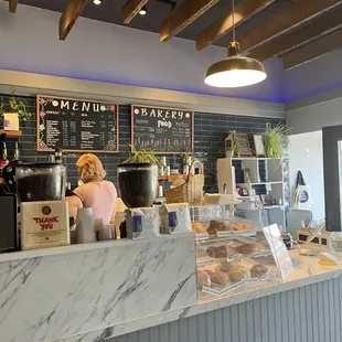 a woman behind the counter
