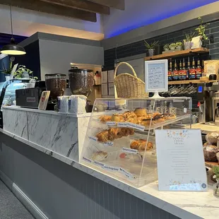 a counter with a variety of pastries