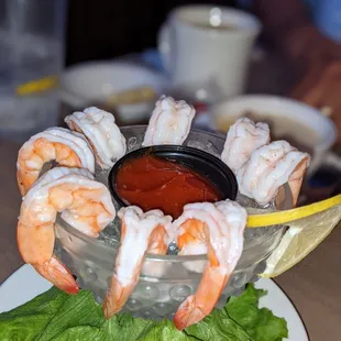 a bowl of shrimp and lettuce