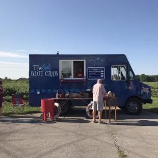 people standing in front of a food truck