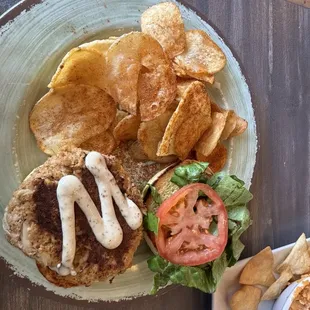 Crab cake sandwich with old bay seasoned fries.
