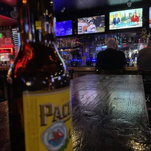 a bottle of beer on the bar