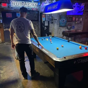 a man playing pool