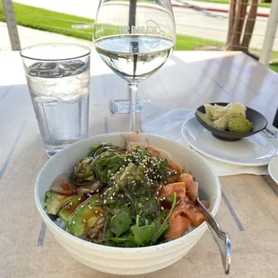 a bowl of food and a glass of water