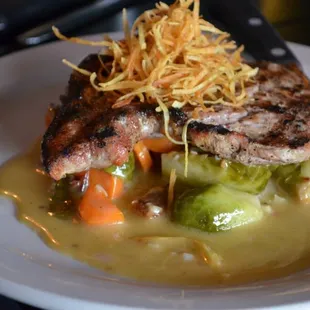 Grilled Pork Chop: spicy dijon cream, brussel sprouts with bacon, sweet potato spears.