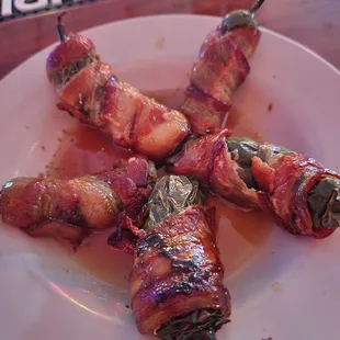 Bacon Wrapped and Sausage Stuffed Jalapeños in a Bourbon Caramel Sauce  ... so so good
