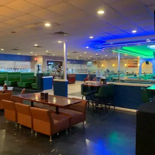 a restaurant with tables and chairs