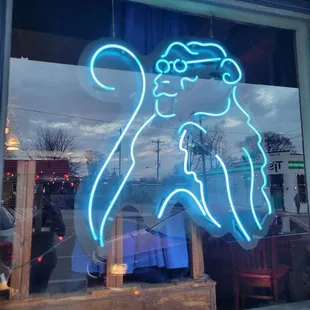 a neon sign in a window