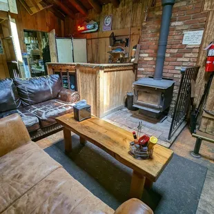 a living room with a wood burning stove