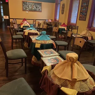 a dining room with tables and chairs