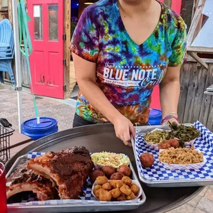 Dinner is served! Our hostess brought these particular plates out. Cool Blue Note Grill shirt.