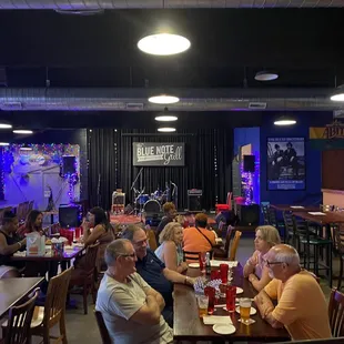 a large group of people sitting at tables