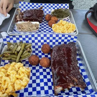 Ribs, Mac and cheese, green beans, collards, and hush puppies