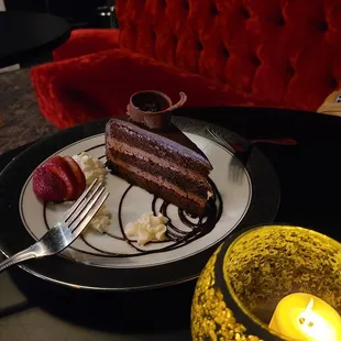 a slice of chocolate cake and strawberries