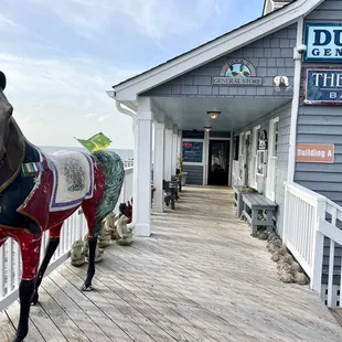 Just outside the entrance to the restaurant on the Duck Boardwalk in the Waterfront Shops