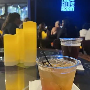 a drink in a plastic cup with a straw