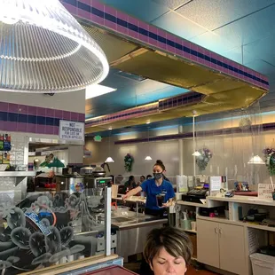 a woman sitting in a diner