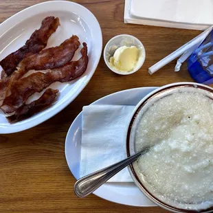Bowl of grits and side of bacon