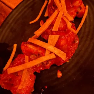 a plate of food with meat and cheese