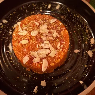 a desert on a black plate