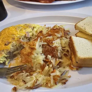 Meat lovers omlette with hashbrowns and sour dough toast