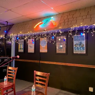 two chairs and a neon sign