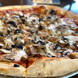 a pizza with mushrooms and cheese