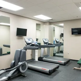 Fitness Center featuring one bike, two treadmill, and free weights.