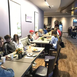 Team and family enjoying breakfast together