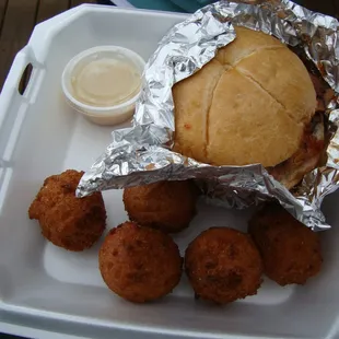 Smoked brisket sandwich combo w/sweet scallion hush puppies.