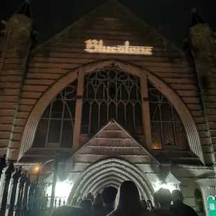 Projected low-res sign on church front