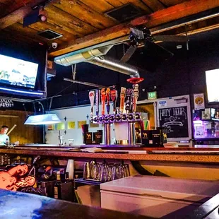 a bar with a large television