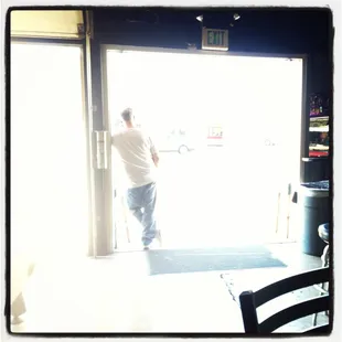 a man entering the door