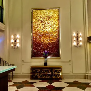 Pass the golden wall art and Up those stairs to TheBlvd