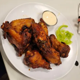 a plate of chicken wings