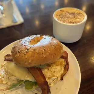 a bagel with bacon and eggs