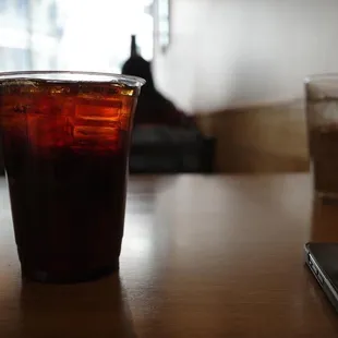 a drink in a glass on a table