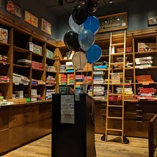 a display of books and balloons
