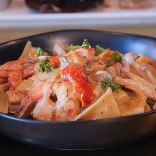 Simple, Elegant, Quality. Local handmade pasta, local shrimp, fresh locals herbs, local citrus.