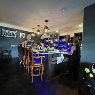 Indoor seating + the bar.. where all the magic happens