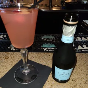 a glass of wine and a bottle of wine