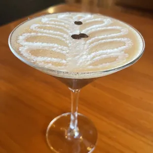 a cocktail in a martini glass