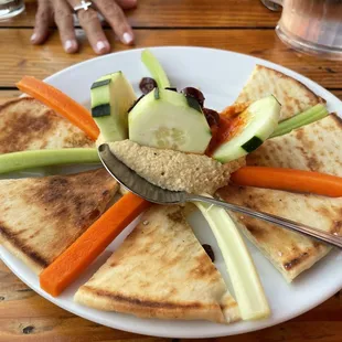 Hummus appetizer (with a few bites already taken out of it)