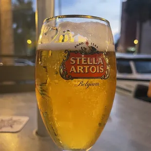 a glass of beer on a table
