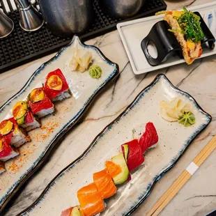 Crunchy spicy tuna roll, rainbow roll, and spicy tuna taco
