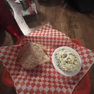 Grilled chicken sandwich with coleslaw.