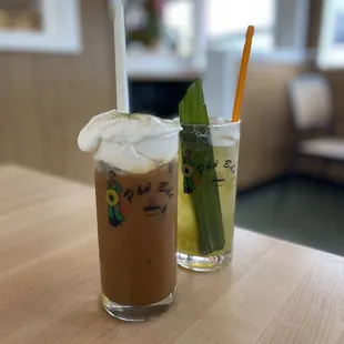 Coconut cloud coffee (front) and pandan iced tea (back)