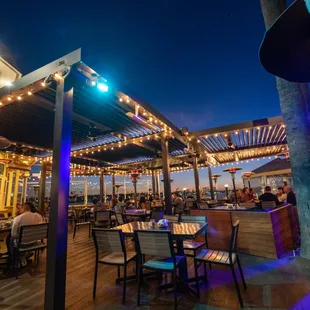 Outdoor patio is great after sunset, with live music every night. Heaters if you get cold. Don't forget that amazing view of the waterfront